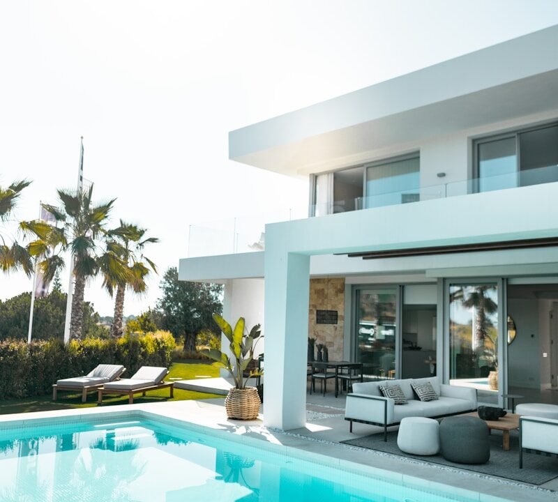 white concrete building with swimming pool